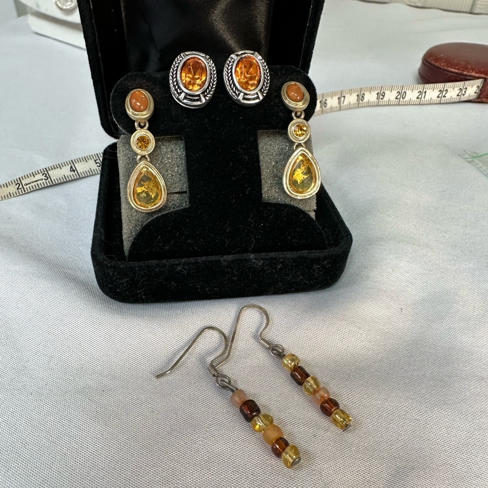 Three pair of neutral tone brown beige amber earrings